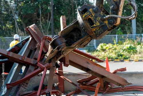 “Large nibbler” attachment for demolition machinery that picks up waste steel frames, demolition work sites, construction industry