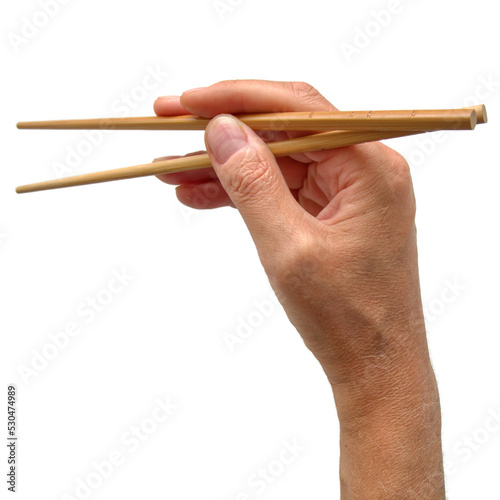 Man's hand holding chopsticks isolated