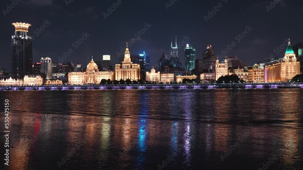 Beautiful landscape of Shanghai bund at night, golden city with reflections on Huangpu river, 4k slow motion footage. Beautiful landscape of Shanghai bund at night, golden city with reflections on Huangpu river, 4k slow motion footage.