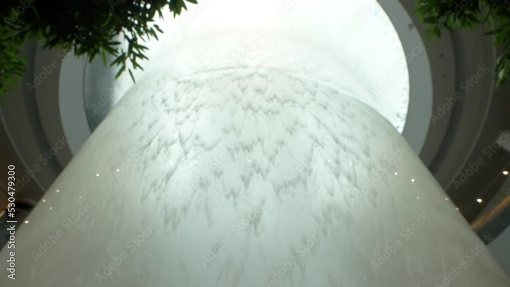 Magnificent vortex with a waterfall inside architecture at Singapore airport.