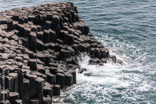 Columnar joints on a wavy beach