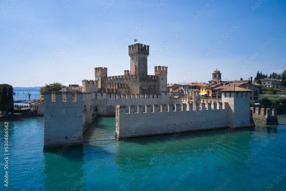 View Town of Sirmione entrance walls view. Aerial view of Sirmione, Lake Garda. Lago di Garda, Lombardy region of Italy drone view.