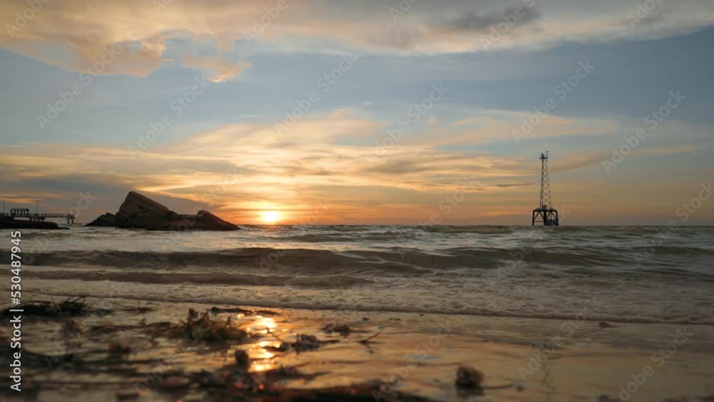 Low angle of waves lapping sandy shoreline at Battery Bigelow, Fort De