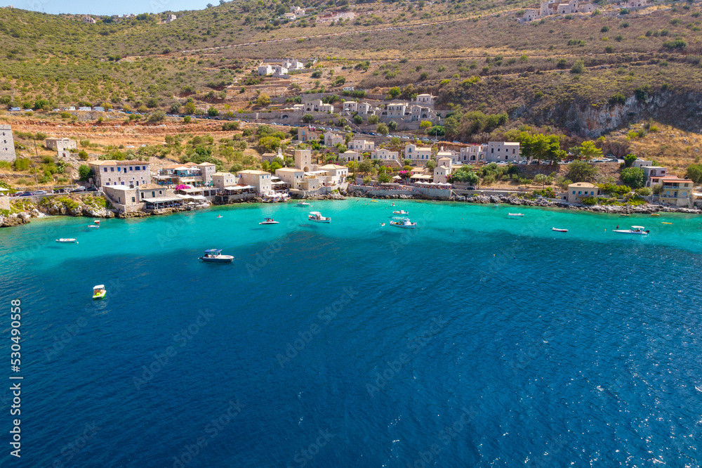 Aerial panoramic photo of Limeni the picturesque  villlage with the turquoise waters and the stone buildings under Areopoli, peloponnese , Greece.