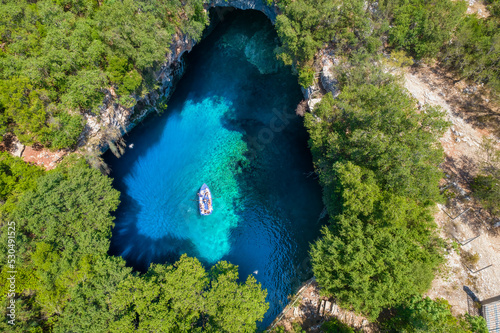 Aerial view of the  iconic Melissani cave with the crystal clear  turquoise waters located near port of Sami  Kefalonia island  Ionian  Greece