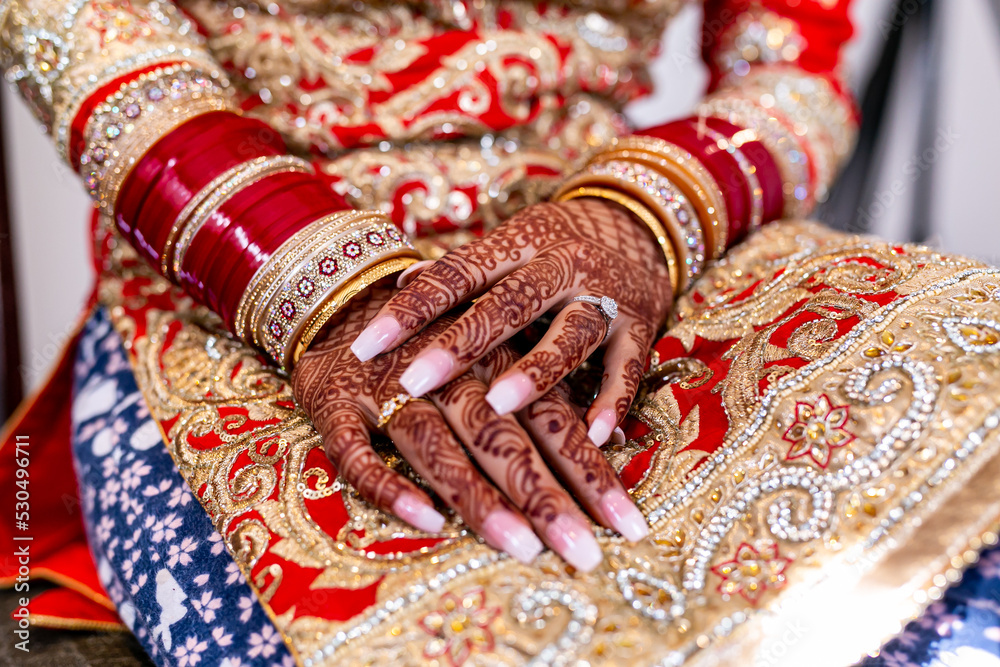 Indian Punjabi bride's hands with henna mehendi mehndi close up