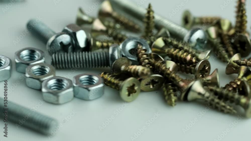 Metal bolts and nuts in a row background. Chromed screw bolts and nuts isolated. Steel bolts and nuts pattern. Set of Nuts and bolts. Tools for work. Metal bolts and nuts in a row background. Chromed screw bolts and nuts isolated. Steel bolts and nuts pattern. Set of Nuts and bolts. Tools for work.