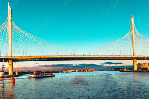 Cable-stayed bridge Western high-speed diameter across Peter's fairway in St. Petersburg at sunset, Russia photo