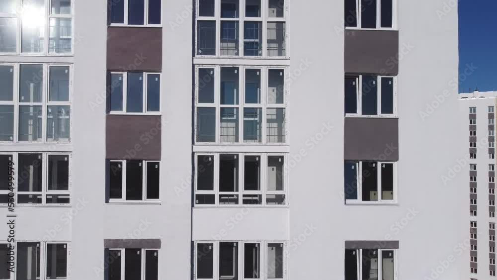 Aerial view of the facade of a residential new building. Aerial view of the facade of a residential new building.