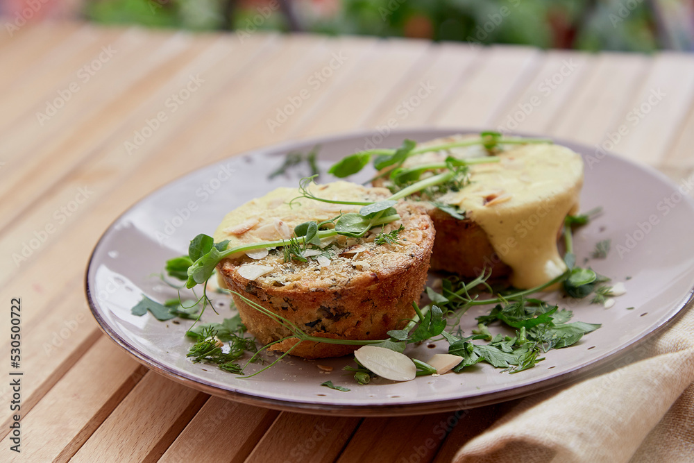 Quiche vegan healthy gluten free muffins with almond flakes, tofu, pea sprouts, greens, vegetables. Healthy food breakfast. Quiche vegan healthy gluten free muffins with almond flakes, tofu, pea sprouts, greens, vegetables. Healthy food breakfast.