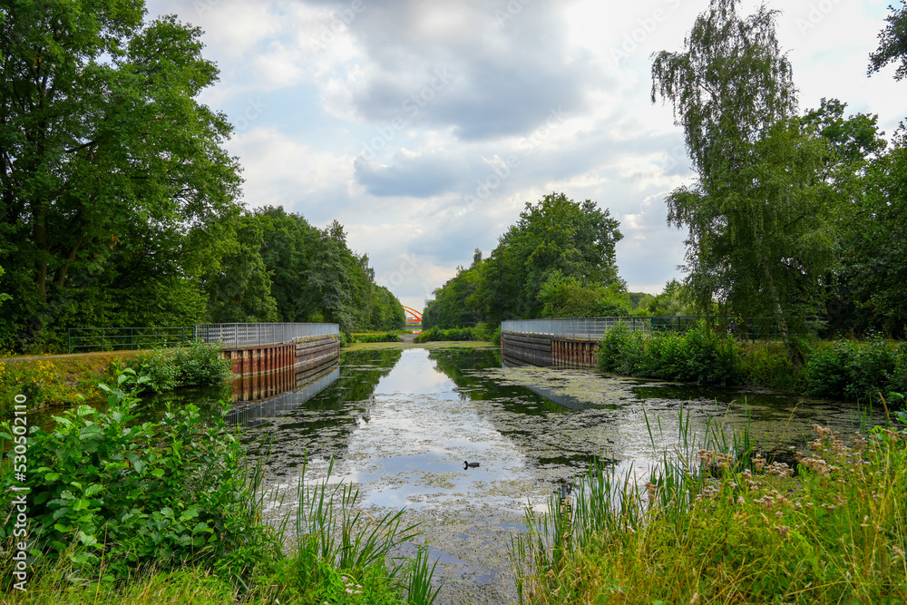 Alte Fahrt, canal near Datteln. Disused section of the Dortmund-Ems Canal with the surrounding nature. Landscape in the Ruhr area.
Alte Fahrt, canal near Datteln. Disused section of the Dortmund-Ems Canal with the surrounding nature. Landscape in the Ruhr area.