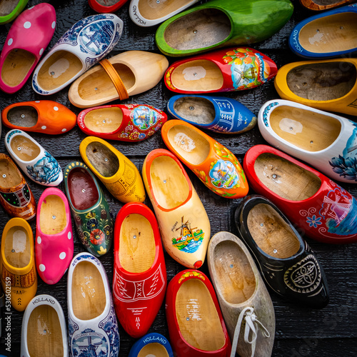 Set of different colorful vintage Dutch wooden clogs © Iryna