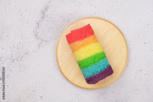  A rainbow cake, jajan pasar, Indonesia traditional food,  variety of sweet cakes that are deliciously colorful. selective focus on cake.