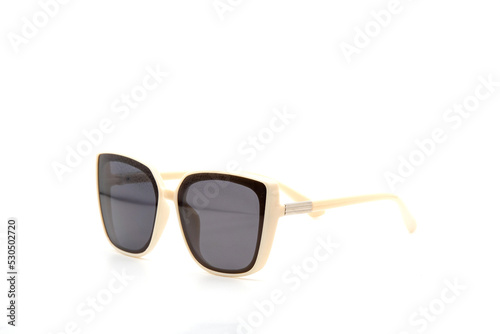 White oversized plastic sunglasses isolated on white background. Trendy round and thick frame fashion with black gradient lens. Different angle view.
