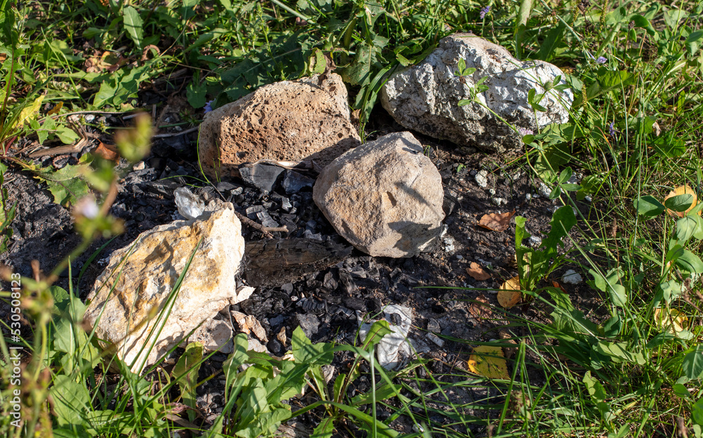 Obraz premium Large stones with coal after a fire