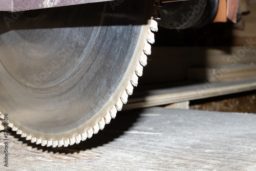 Industrial saw blade with serrations close up photo