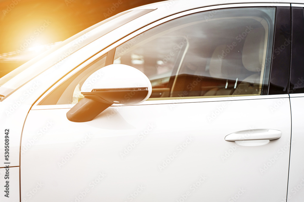 Fototapeta premium Door of modern car. Fragment of the door with handle, silver texture