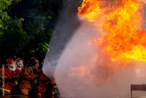 Firefighters are practicing firefighting plans are putting out a burning fire