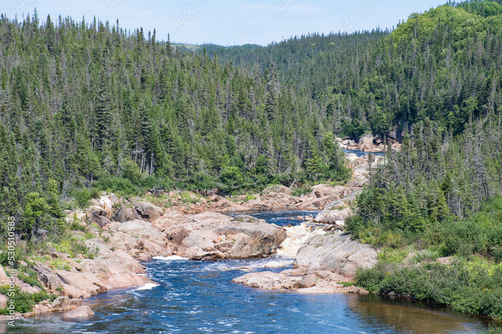 Beautiful view of a river flowing in the Côte-Nord region of Quebec, Canada