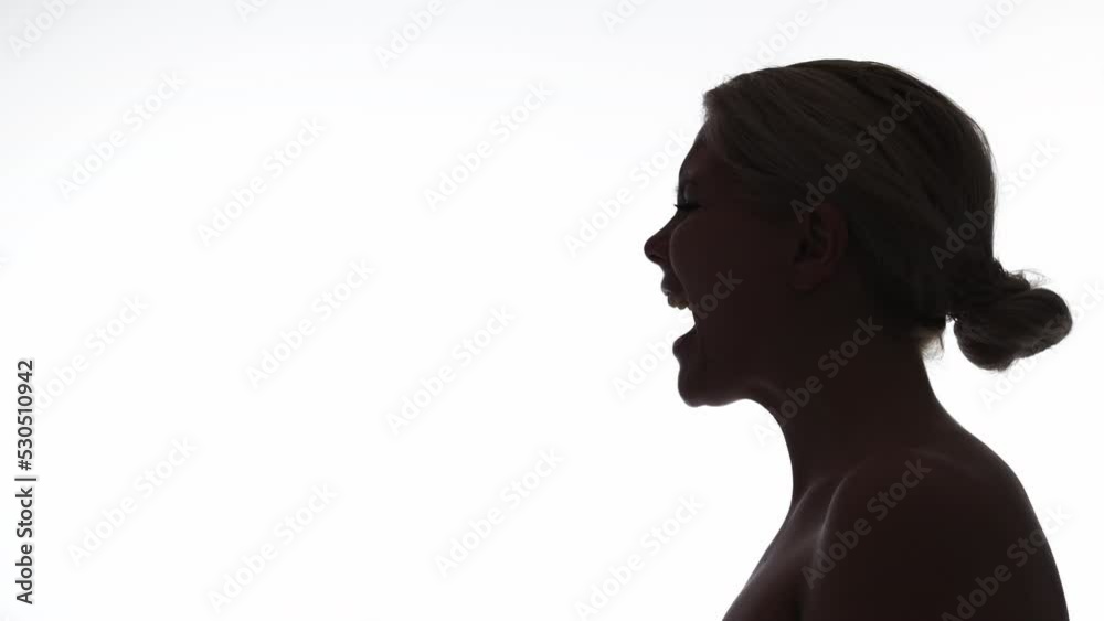 Anger emotion. Stress frustration. Nervous breakdown. Dark profile silhouette of dissatisfied anxious mad woman yelling isolated on white copy space background.
