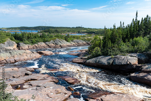 Beautiful view of a river flowing in the Côte-Nord region of Quebec, Canada