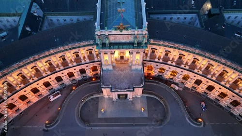 Aerial view of Vienna at night with illuminated historic touristic landmark, Hofburg palace facade in the evening light in Vienna city centre photo