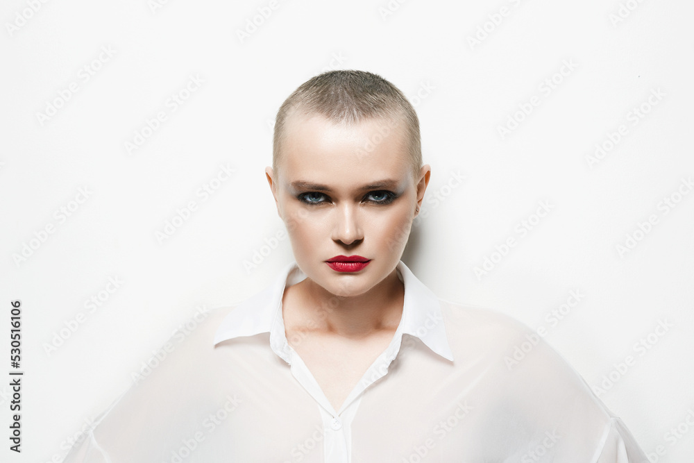 pretty woman with short haircut in white light. portrait of bald girl pretty woman with short haircut in white light. portrait of bald girl