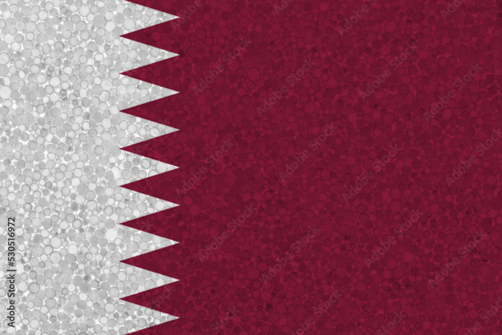 Obraz premium Flag of Qatar on styrofoam texture. national flag painted on the surface of plastic foam