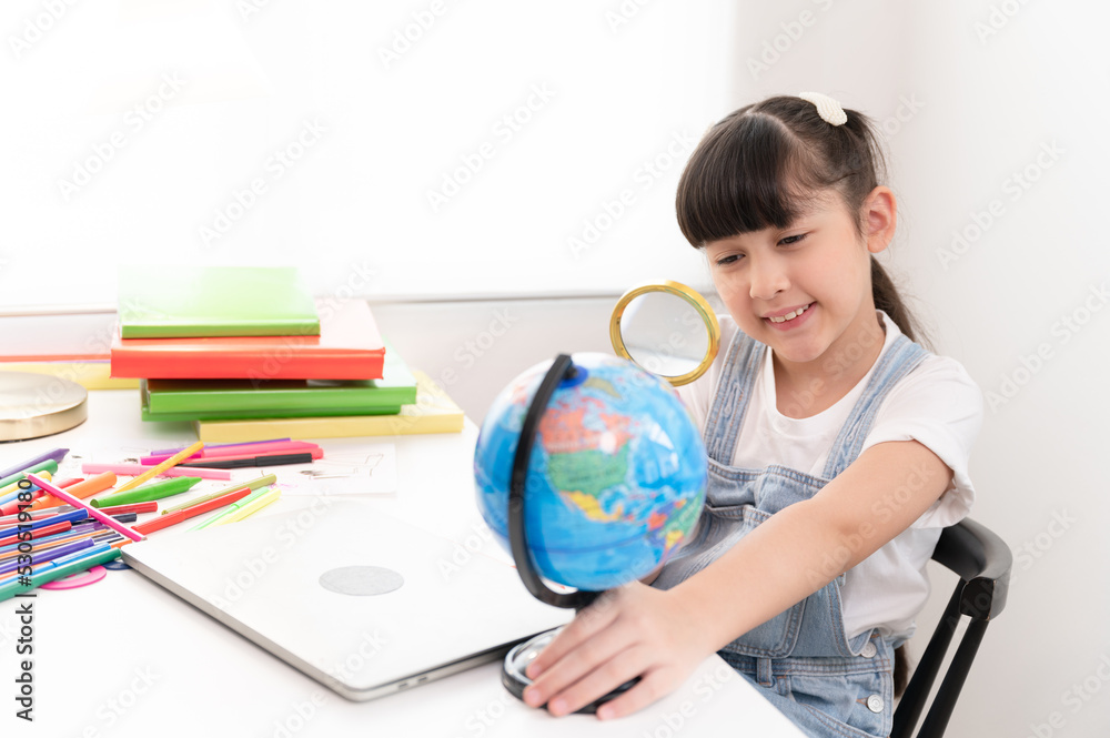 Kids girl funny with use magnifying glass in living room at home Kids girl funny with use magnifying glass in living room at home