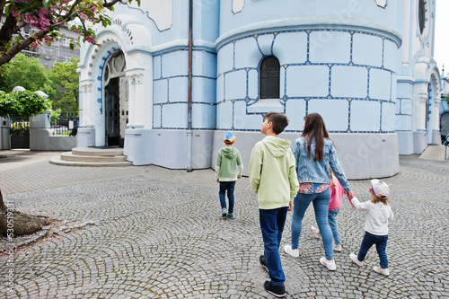 Mother with kids walking near Blue Church at Bratislava, Slovakia. photo