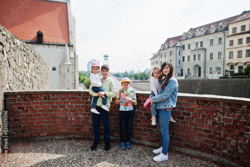 Mother with kids on view of street Bratislava, Slovakia.