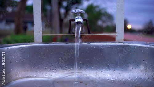 WATER FLOWING FROM A TAP photo