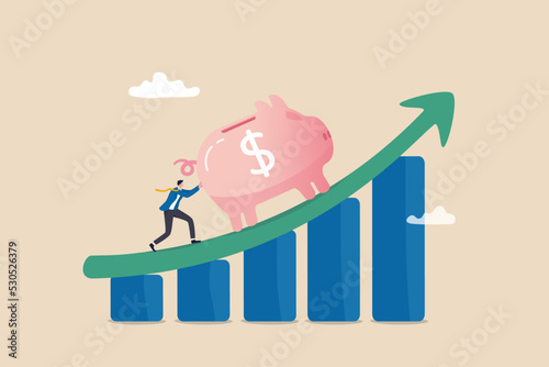 Saving or investment profit, compound interest graph or wealth incremental, investment earning from stock market or mutual fund concept, rich businessman push big piggy bank up rising graph and chart.