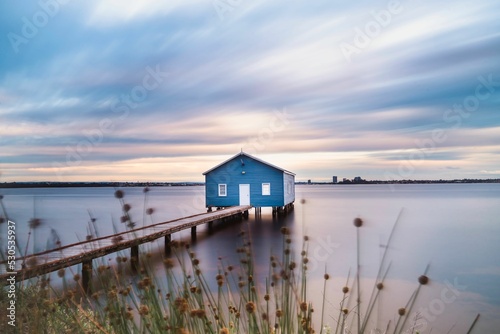 Bild auf Leinwand Blue boat house over a background of a beautiful sky,  Perth, Australia