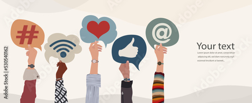 Group of raised hands of diverse culture of people holding speech bubble with social media signs and symbols. Concept sharing friendship exchange community communication on social media