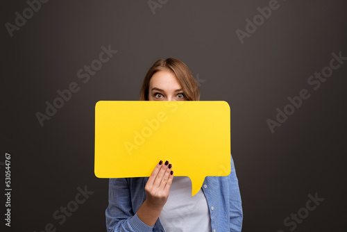 Shocked woman covering face with speech bubble