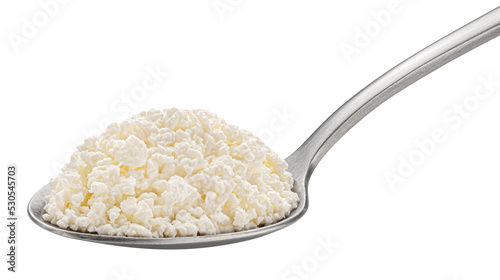 Cottage cheese in spoon isolated on white background