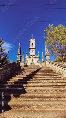 Vertical shot of stairs leading to the Church of Nossa Senhora do Castelo in Coruche, Portugal photo