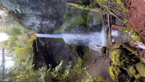 Vertical Shot Of Majestic Marymere Falls In Olympic National Park Near Lake Crescent In Washington, USA. tilt-up photo