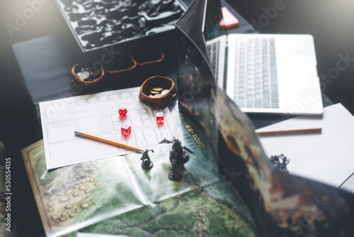 Bild auf Leinwand Dungeon master screen with dice and miniatures for role playing tabletop and boa