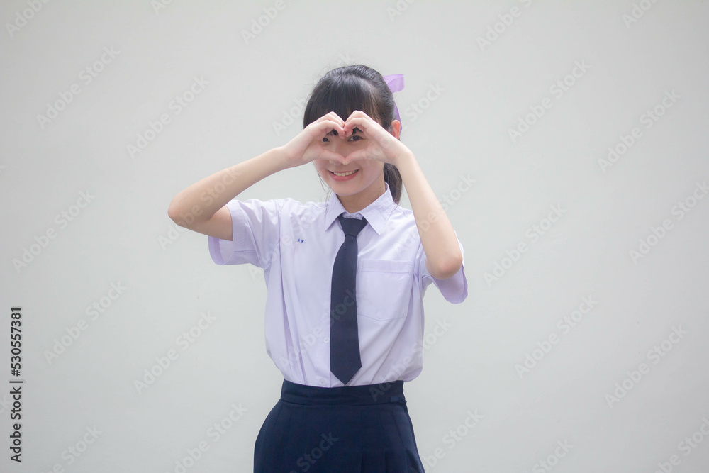Portrait of thai high school student uniform beautiful girl give heart Portrait of thai high school student uniform beautiful girl give heart