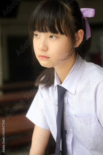 Portrait of thai Junior high school student uniform teen beautiful girl happy and relax