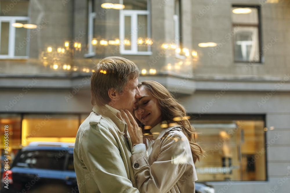 Fototapeta premium a young couple in love is walking around the city, in an autumn city