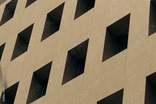Minimal and abstract architectural structure, beige pastel tones modern building, symmetrical windows, relaxing and simple structure