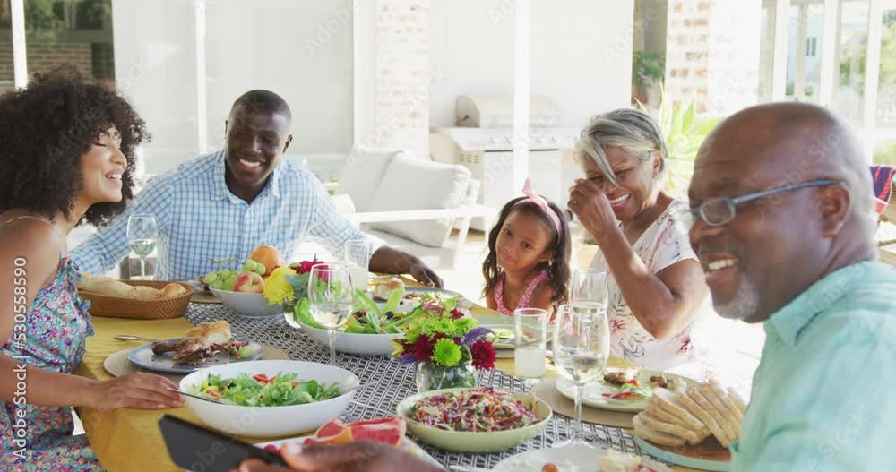 Video of african american family spending time together and having dinner outside Video of african american family spending time together and having dinner outside