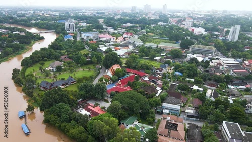 Orbiting aerial overview of Chiang Mai, Thailand.  An amazing low-key northern city with a laid-back vibe.  The city is popular with digital nomads for its affordable living, and modern lifestyle. photo