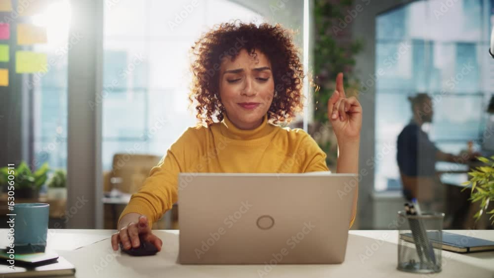 Young Middle Eastern Project Manager Listening to Music, Fooling Around and Dancing at Her Desk. Beautiful Multiethnic Female Specialist is Working on Laptop Computer in Creative Office.