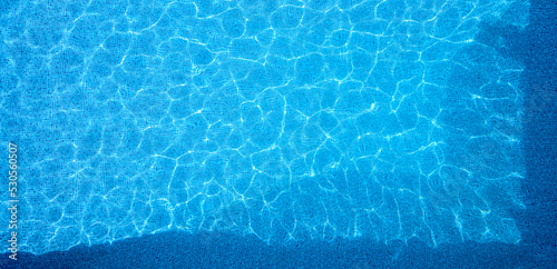 Overhead Drone Shot Of Clear Blue Water In Swimming Pool photo