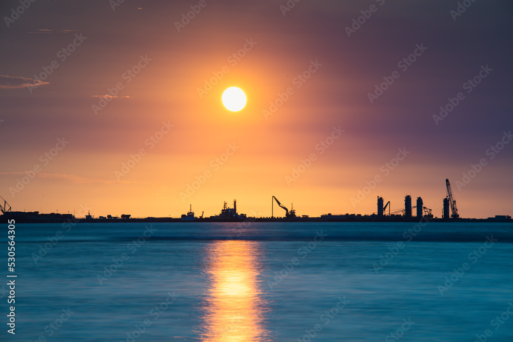 A wharf under construction along the coast. Silhouette of the dusk pier construction. Tiwan