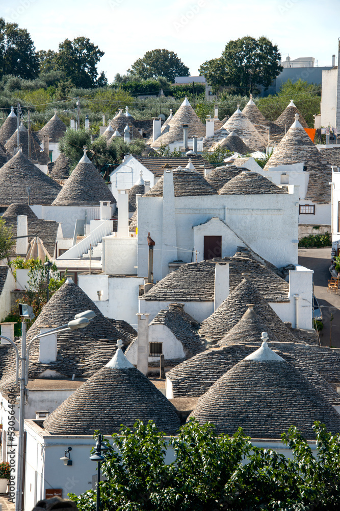 Apulia Symbol typical trulli houses in Alberobello, Puglia, Italy. Traditional ...